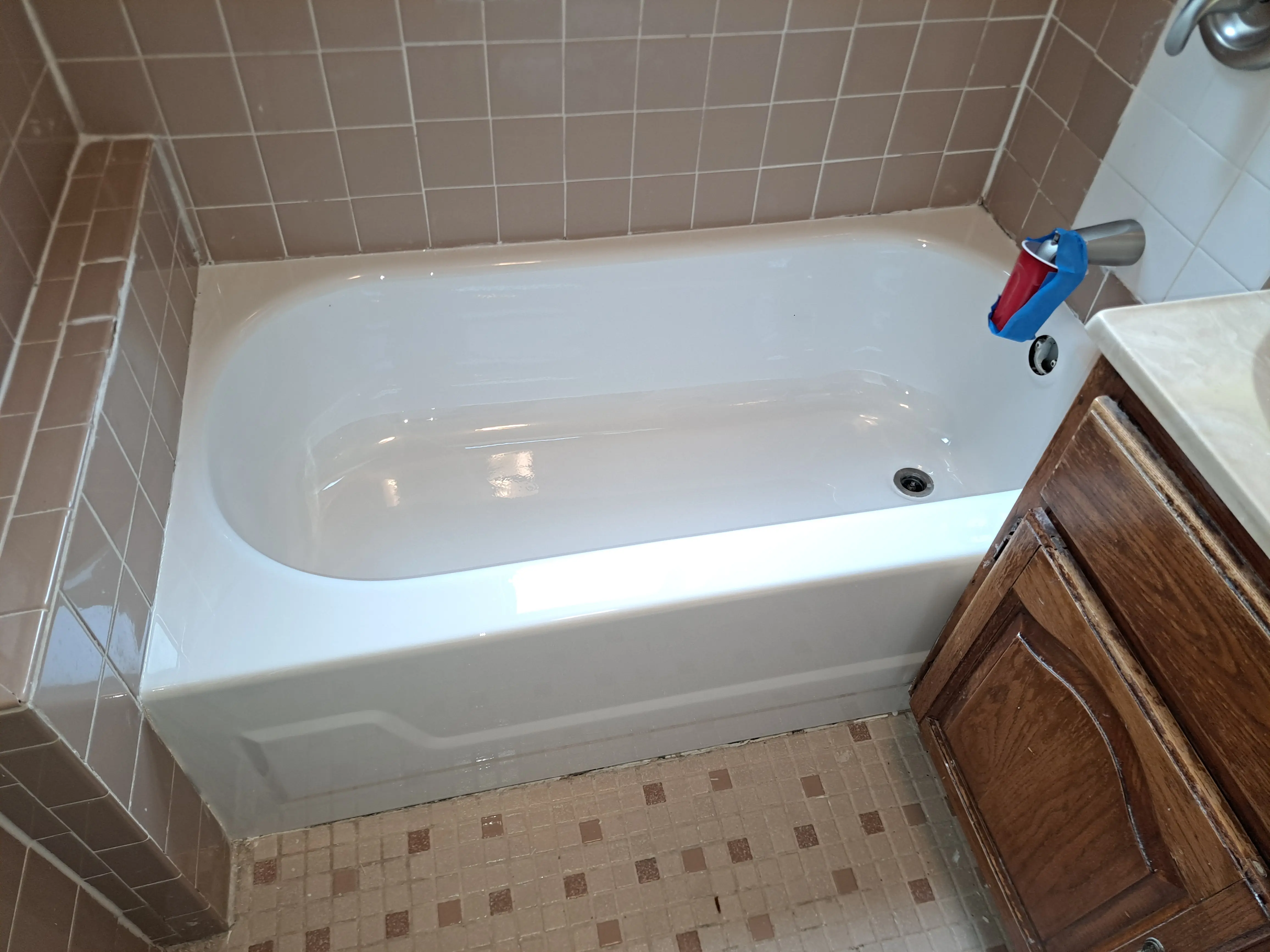 Tub after refinishing: glossy mirror-like surface