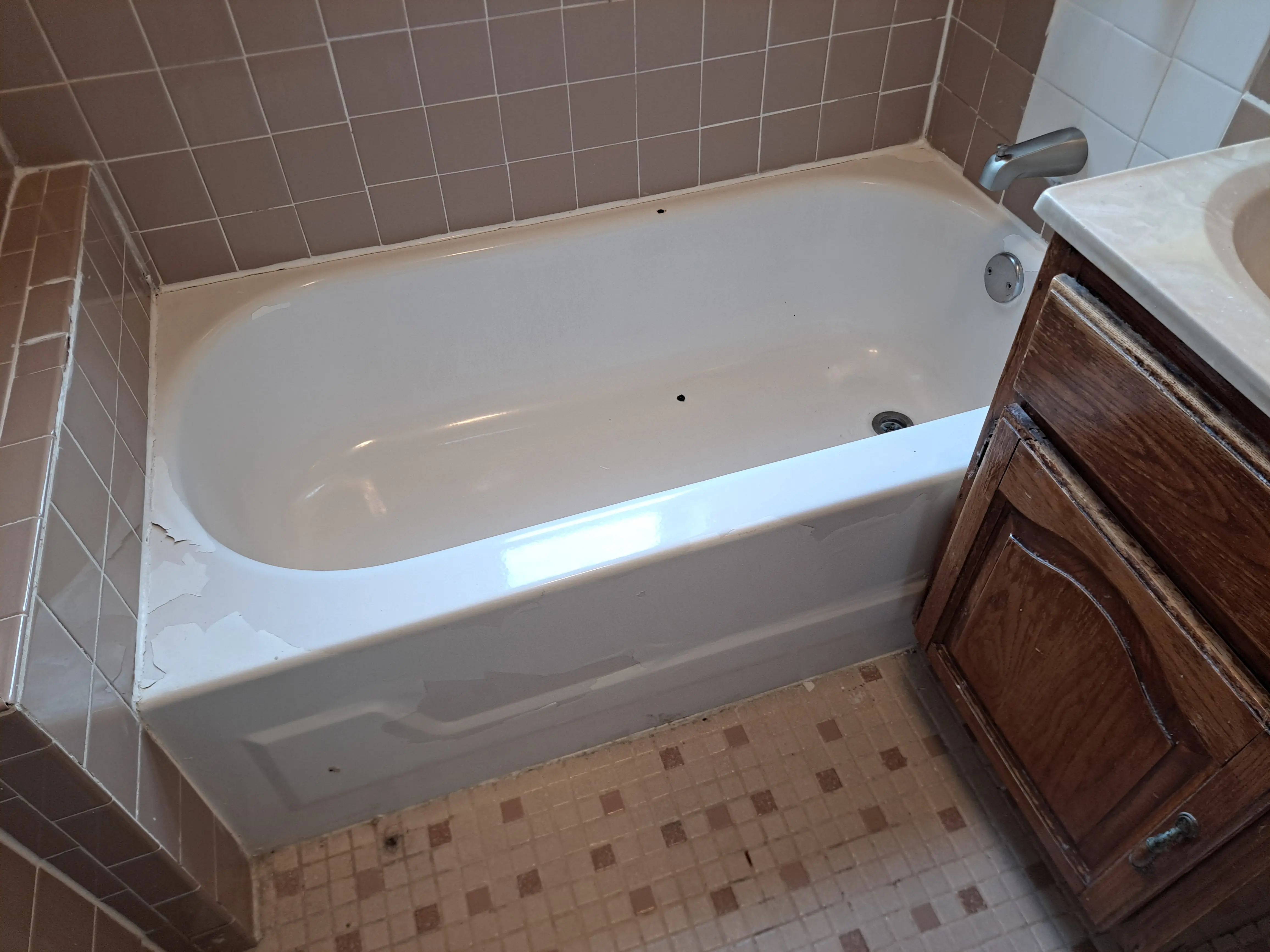 Tub before refinishing: stains and chips