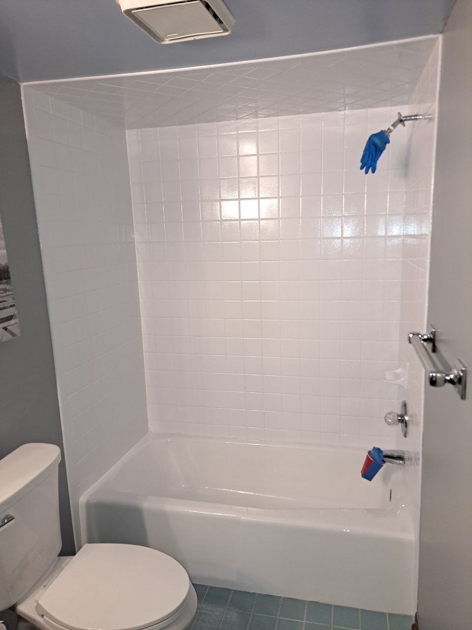 After — restored shower base in bright white