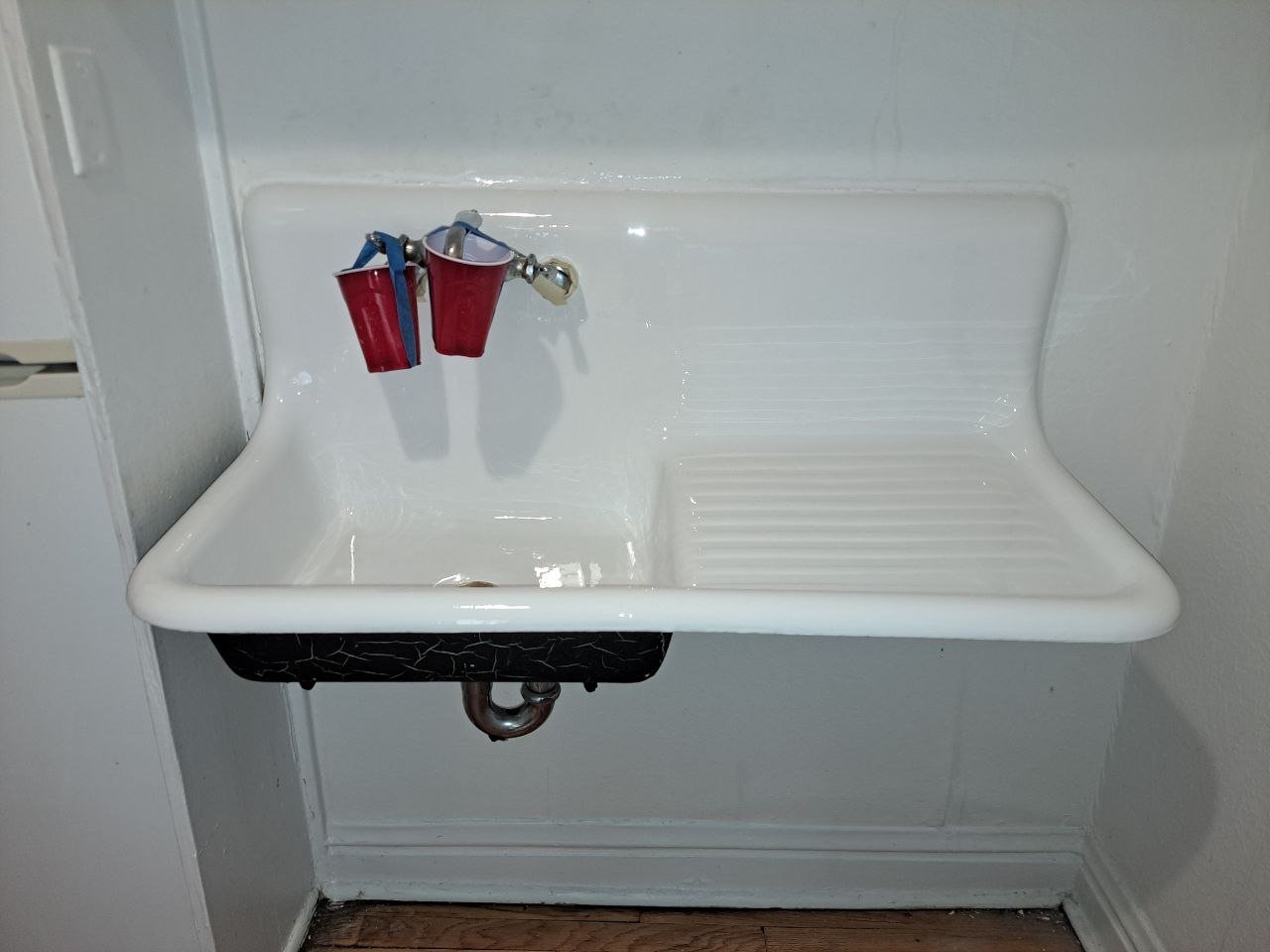 After — refinished sink with glossy surface